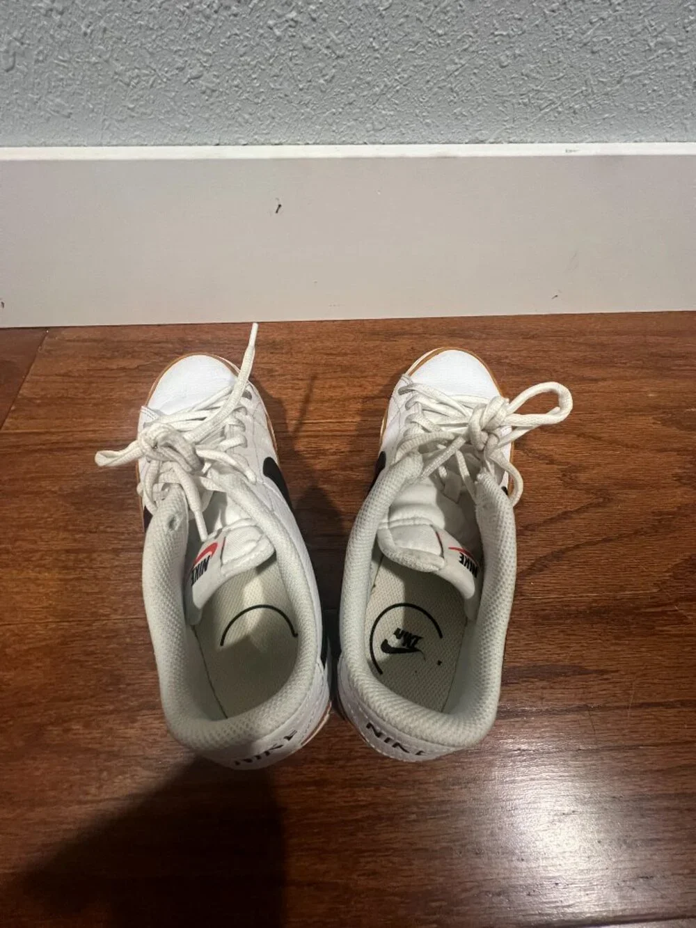 Nike Court Legacy White Sneakers with Black Swoosh and Tan Accent